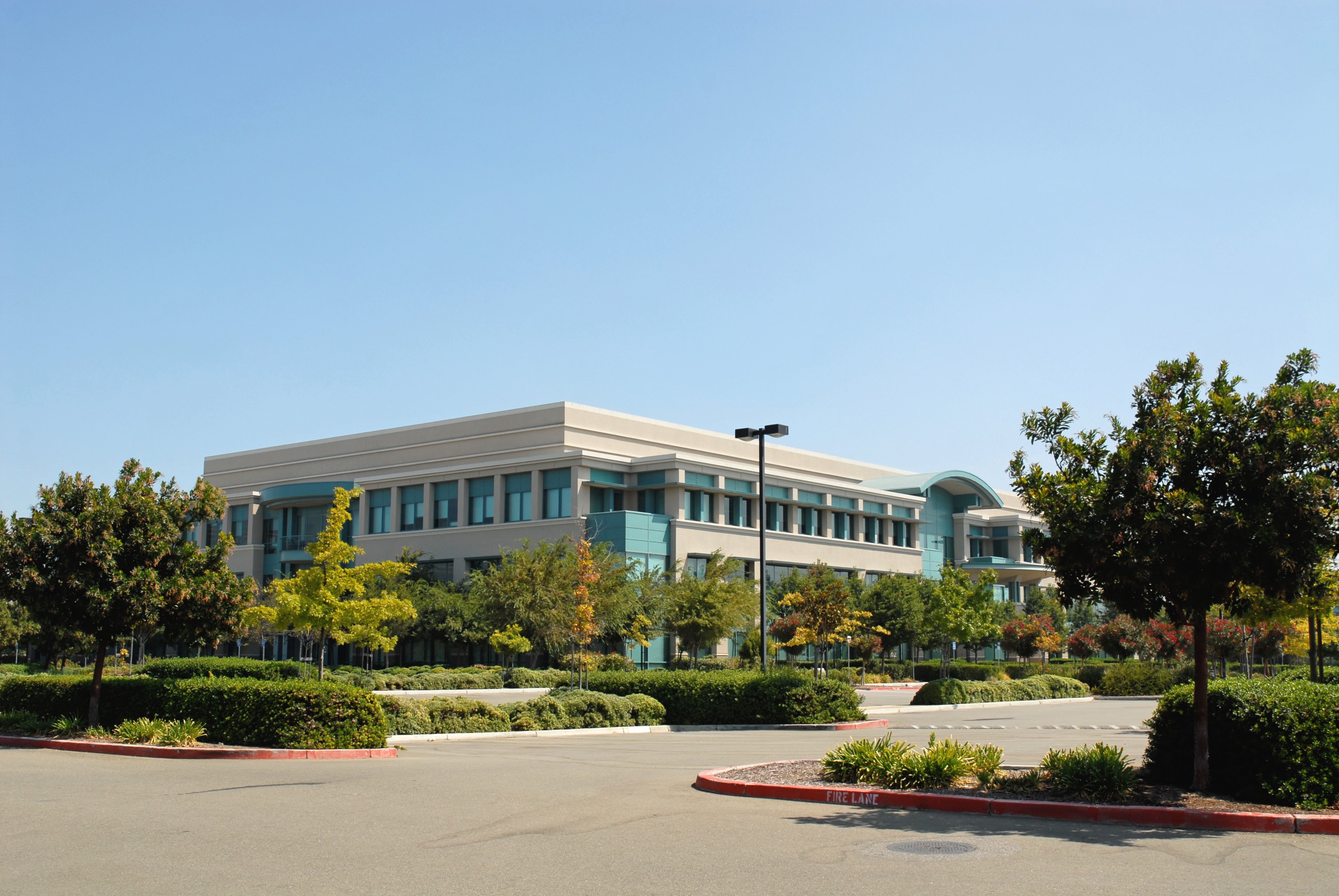 Commercial Incentives Image - A commercial office building surrounded by greenery.